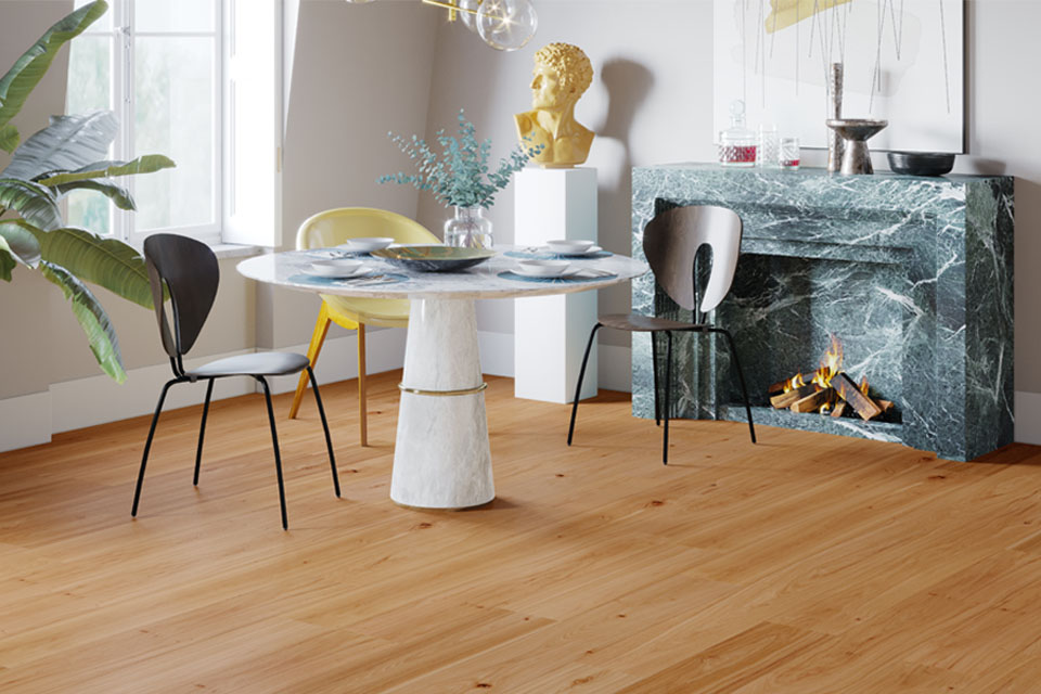 wood floors with yellow accents and stone fireplace